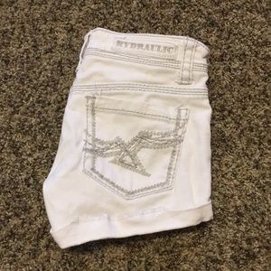 White Hydraulic booty shorts.